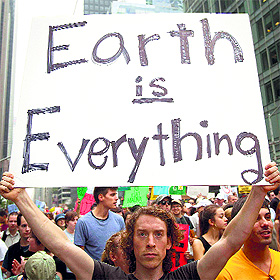A protester carries a sign during the Peoples Climate March in the Manhattan borough of New York on Sunday.