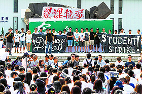 Students gather during a strike as a pro-democracy activist (L) speaks at the Chinese University of Hong Kong on Monday. 