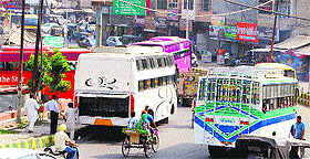 Buses parked on Bhandari Bridge opposite Hall Gate in Amritsar on Tuesday.