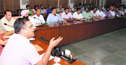 Deputy Commissioner Basant Garg during a meeting at District Administrative Complex on Tuesday. Photos: Vijay Kumar
