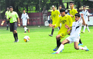 A match in progress between the Chandigarh Football Association and the Dalbir Football Academy in Sector 17, Chandigarh, on Tuesday. 