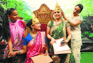 Women artistes get ready to play their part in the Ramlila at Sector 28, Chandigarh, on Tuesday.