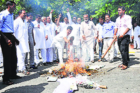 Members of the Rajput community burn an effigy of state BJP chief Ram Bilas Sharma in Karnal on Tuesday.