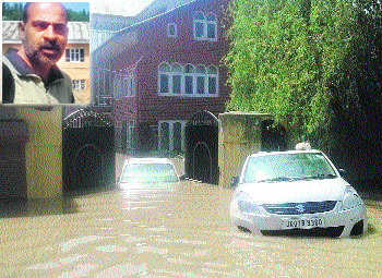 A file photo of the flooded Balgarden locality in Srinagar where Tufail Wani (inset) resides. 