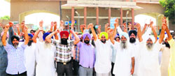 Transporters stage a protest outside the ICP gate in Attari on Tuesday. photo: Vishal Kumar