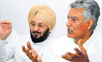 Sunil Jakhar, CLP Leader, and Laal Singh at a press meet in Chandigarh on Tuesday. Tribune photo: Manoj Mahajan