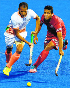Indias SV Sunil dribbles past Omans Ahmed Nofali during their match in Incheon on Tuesday. India won 7-0.