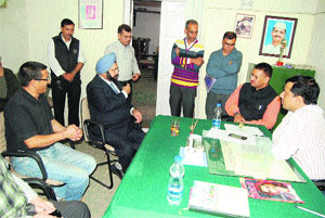 Mussoorie MLA Ganesh Joshi interacts with MDDA officials at the compounding camp in Mussoorie on Tuesday.