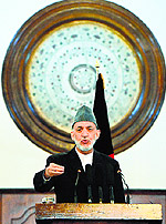 Outgoing Afghan President Hamid Karzai addresses a gathering of government employees in Kabul on Tuesday