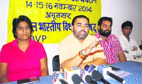 Organising minister for the north zone of the ABVP Srinivas (centre) addresses mediapersons in Amritsar on Wednesday