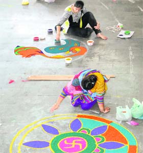 Whirl of beauty: Students show their talent during the rangoli competition organised as part of the three-day Zonal Youth Festival of educational colleges affiliated to the GNDU on Wednesday