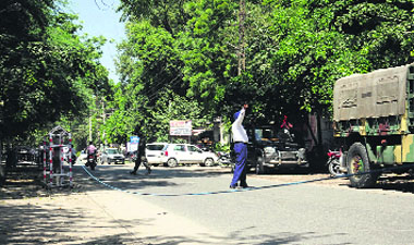 Iron barricades installed by the traffic policemen alongside the boundary walls of the District Administrative Complex in Bathinda on Wednesday.