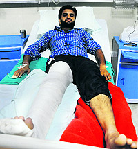 Satinder Singh, who was injured after his bike was hit by a PCR motorcycle, at the Sohana Hospital in Mohali on Wednesday
