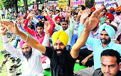 Members of the MGNREGA Contract Employees Union (Punjab) hold a protest at Vikas Bhawan in Mohali on Wednesday