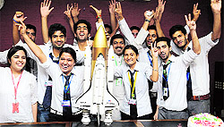 Students of Gurukul Vidyapeeth celebrate the successful entry of Mangalyaan into the Mars orbit, in Chandigarh on Wednesday
