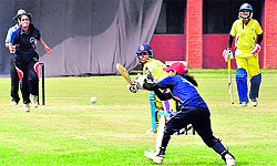 A player hits a shot during the final of the First Rama Atray Memorial Women Cricket Tournament in Chandigarh on Wednesday