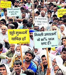 Followers of Sant Rampal stage a rally at the Sector 25 rally ground in Chandigarh on Wednesday. Traffic in the city went haywire due to the rally