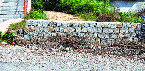 The Spiti childrens hostel road blocked by a villager on the Rakkar road at Sidhbari near Dharamsala.