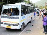 A bus damaged by a crowd near Mandi on Wednesday.