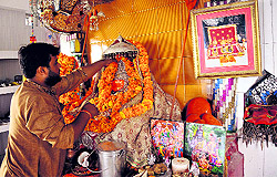 The priest at Maha Maya Temple in Jammu preparing for the Navratra festival on Wednesday