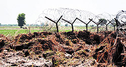 The damaged fence on the international border in Jammu