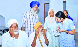 Patients get their eyes tested during the camp at the GNN College in Doraha on Wednesday.