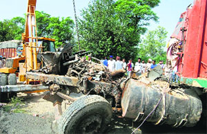 The mangled remains of a truck-trailer at Benra village in Sangrur on Wednesday