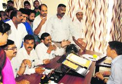 BJP workers at the District Supply Office in Dehradun on Tuesday. a Tribune photograph