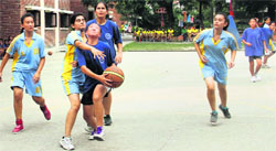 Players in action in a keenly-played match in the DDSCA Girls Under -15 Inter School Basketball Tournament in Dehradun on Tuesday. Tribune photo: Vinod Pundir