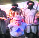 A video grab shows French mountaineer Herve Gourdel with members of Jund al-Khilafah.