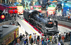 Visitors look at a C57 steam locomotive at a rail museum in Omiya, Japan. Fifty years ago, the first bullet train pulled out of Tokyo station and hurtled across the countryside.