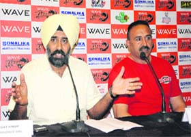 Former Indian hockey player Pargat Singh (left) addresses mediapersons in Amritsar on Thursday