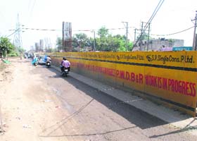 A view of iron barricades installed at BRTS construction site to prevent escaping of dust and soil in Amritsar on Thursday