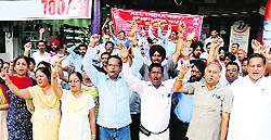 Employees hold a demonstration under the banner of the All-India Bank Employees Association in Bathinda on Thursday