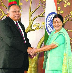 The External Affairs Minister Sushma Swaraj greets her Bangladeshi counterpart Abdul Hassan Mahmood Ali during a meeting in New Delhi.