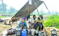 A family in the Jammu region living in the open after their house was washed away in the floods. A Tribune File Photo