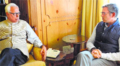 Governor NN Vohra with Chief Minister Omar Abdullah at Raj Bhawan in Srinagar on Thursday. A Tribune Photograph