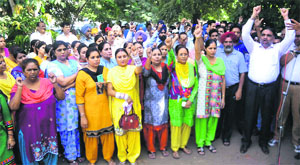 Members of the Punjab Bank Employees Federation (Ludhiana) protest in front of the State Bank of Patiala, Zonal Office, at Miller Ganj in Ludhiana.
