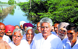 Sunil Jakhar, Leader of the Opposition, at a waterlogged village in Abohar