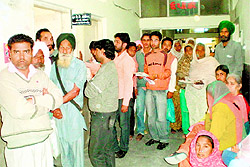 Patients wait for their turn at the Civil Hospital, Bathinda