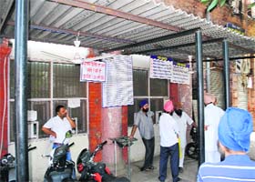 Closed windows of the Birth and Death Certificate Department as the employees went on a token strike in Amritsar on Friday