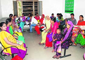 Patients wait for their turn in the waiting room of the ultrasound centre in the Civil Hospital, Amritsar on Friday