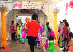 No policemen are deputed at the entrance gate of Bara Hanuman Mandir, Durgiana Temple, during the festival season in Amritsar on Friday