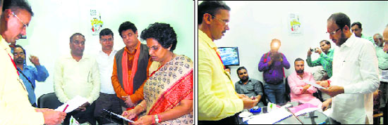 BJP candidate Latika Sharma; and (right) INLD candidate Pradeep Chaudhary file their nomination papers at the office of the Returning Officer in Kalka on Friday