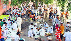 People perform pind-daan during Phalgu fair at Pharal village in Pundri