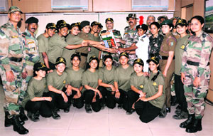 Lt Gen A Chakravarty, NCC Director General, poses with the girls mountaineering expedition team in Jammu on Friday. 