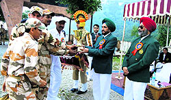 Harbhajan Singh, IG, ITBP, gives away the trophy to the winners of the Fourth Inter-Frontier Rock Climbing Tournament in Mussoorie on Friday