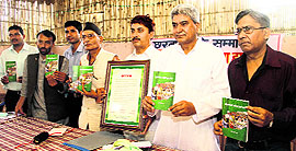 Environmentalist Suresh Bhai (second from right) releases his book at a function in Dehradun on Friday