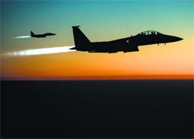 A pair of US Air Force F-15E Strike Eagles fly over northern Iraq after conducting air strikes in Syria