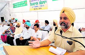 Agriculture expert Dr Khushiar Singh speaks during the kisan mela.